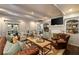 Comfortable living room with hardwood floors, wood coffee table, and built-in bookcases at 1466 University Dr, Atlanta, GA 30306