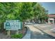 Street view of the Virginia Highland neighborhood with the welcome sign, trees, and local businesses at 1466 University Dr, Atlanta, GA 30306