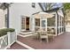 Inviting back patio with outdoor seating, an umbrella, and access to the home's interior at 1466 University Dr, Atlanta, GA 30306