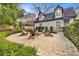 Backyard patio area with a fire pit and Adirondack chairs, perfect for outdoor gatherings at 1466 University Dr, Atlanta, GA 30306