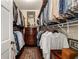 Organized walk-in closet features ample hanging space and built-in shelving, maximizing storage and convenience at 1466 University Dr, Atlanta, GA 30306