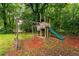 Backyard play area featuring a swing set and slide for outdoor fun at 218 Woodview Se Ln, Smyrna, GA 30082