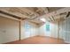 Unfinished basement with concrete block walls, two exterior doors, and exposed ductwork at 218 Woodview Se Ln, Smyrna, GA 30082