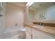 Bathroom with white tiling, a granite vanity and a large mirror at 218 Woodview Se Ln, Smyrna, GA 30082