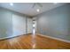 Bedroom with hardwood floors, a closet, and a ceiling fan at 218 Woodview Se Ln, Smyrna, GA 30082