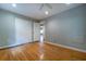 This bedroom features hardwood floors, neutral paint, a closet and a ceiling fan at 218 Woodview Se Ln, Smyrna, GA 30082