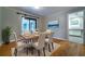 Elegant dining room with a stylish rug, ample seating and a sliding door at 218 Woodview Se Ln, Smyrna, GA 30082