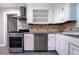 Well-equipped kitchen boasts stainless steel appliances, and ample counter space at 218 Woodview Se Ln, Smyrna, GA 30082