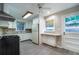Functional kitchen with white cabinets, tile backsplash, and stainless steel appliances at 218 Woodview Se Ln, Smyrna, GA 30082