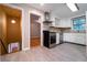 Updated kitchen with modern stainless steel appliances and a view of stairway at 218 Woodview Se Ln, Smyrna, GA 30082