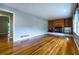 Open living room with gleaming hardwood floors and a cozy fireplace feature at 218 Woodview Se Ln, Smyrna, GA 30082