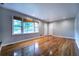 Open living room with hardwood floors and an abundance of natural light at 218 Woodview Se Ln, Smyrna, GA 30082