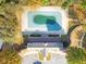 Overhead shot of a community pool covered for the off season and nearby clubhouse with ample parking at 2450 Mildon Hall Ln, Lawrenceville, GA 30043