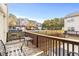 Cozy back deck offers serene views of neighboring townhomes, perfect for outdoor relaxation and entertaining at 2450 Mildon Hall Ln, Lawrenceville, GA 30043