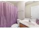 Traditional bathroom featuring a single vanity and a shower with a curtain at 2450 Mildon Hall Ln, Lawrenceville, GA 30043