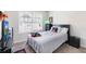 Bedroom with a window, carpet floors, and ceiling fan at 2450 Mildon Hall Ln, Lawrenceville, GA 30043