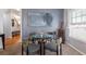 Cozy dining area featuring a glass table and stylish chairs near a window, perfect for intimate meals at 2450 Mildon Hall Ln, Lawrenceville, GA 30043