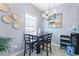 Charming dining area with modern table, chairs and stylish chandelier, perfect for Gathering meals at 2450 Mildon Hall Ln, Lawrenceville, GA 30043