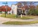 Street view showcasing this well-maintained home with mature trees and manicured landscaping at 2450 Mildon Hall Ln, Lawrenceville, GA 30043