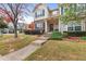 Beautiful home with landscaped front yard, stone accents, and a welcoming entrance at 2450 Mildon Hall Ln, Lawrenceville, GA 30043