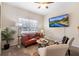 Bright living room with large windows, stylish furniture, and comfortable seating area at 2450 Mildon Hall Ln, Lawrenceville, GA 30043