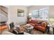 Cozy living room with natural light, modern decor, and comfortable seating arrangements at 2450 Mildon Hall Ln, Lawrenceville, GA 30043