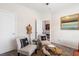 Comfortable sitting room with two chairs and a small table next to the large living area at 2450 Mildon Hall Ln, Lawrenceville, GA 30043