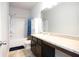 Well-lit bathroom with a combination tub and shower unit and vanity with good storage at 103 Prominence Ct, Canton, GA 30114
