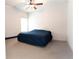 Cozy bedroom with a ceiling fan and neutral carpet, creating a comfortable and inviting atmosphere at 103 Prominence Ct, Canton, GA 30114