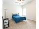 Bright bedroom with a ceiling fan, window, and a comfortable bed, offering a cozy retreat at 103 Prominence Ct, Canton, GA 30114