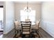 A well-lit dining area featuring a stylish table with seating for four at 103 Prominence Ct, Canton, GA 30114