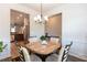 Open dining area with a view into the kitchen and stainless steel appliances at 103 Prominence Ct, Canton, GA 30114