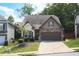 Charming home with stone accents, well-manicured lawn, and inviting curb appeal at 103 Prominence Ct, Canton, GA 30114