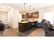 Modern kitchen with granite countertops, dark wood cabinets, stainless appliances and an island with seating at 103 Prominence Ct, Canton, GA 30114