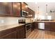 Modern kitchen with granite countertops and stainless steel appliances at 103 Prominence Ct, Canton, GA 30114