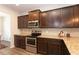 Stylish kitchen featuring dark cabinetry and a modern stainless steel oven at 103 Prominence Ct, Canton, GA 30114