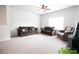 Bright living room with neutral carpet and ample seating, perfect for Gathering gatherings and relaxation at 103 Prominence Ct, Canton, GA 30114