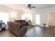 Inviting living room with comfortable seating, wood floors, and ample natural light near an exterior door at 103 Prominence Ct, Canton, GA 30114