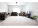 Spacious living room with neutral carpet, ceiling fan, and ample seating, perfect for relaxation and entertaining at 103 Prominence Ct, Canton, GA 30114