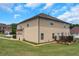 Spacious backyard with a wooden deck and vinyl siding on a two-story house at 1104 Stepping Stone Ln, Conyers, GA 30012
