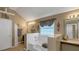 Bathroom with a tub, a king sign, and decorative elements for a stylish and functional space at 1104 Stepping Stone Ln, Conyers, GA 30012