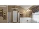 Bathroom featuring a large soaking tub, separate shower, and elegant decor at 1104 Stepping Stone Ln, Conyers, GA 30012