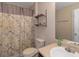 Bright bathroom featuring a shower, vanity, and toilet, providing a functional space at 1104 Stepping Stone Ln, Conyers, GA 30012