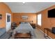Cozy bedroom featuring orange walls, a comfortable bed, and decorative wall art at 1104 Stepping Stone Ln, Conyers, GA 30012