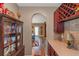 Dining area featuring a decorative china cabinet, tile countertops and wine rack at 1104 Stepping Stone Ln, Conyers, GA 30012