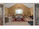 Inviting living room featuring vaulted ceilings, neutral walls, and comfortable seating arrangements at 1104 Stepping Stone Ln, Conyers, GA 30012