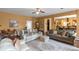 Comfortable living room with couches, ceiling fan, and open access to other rooms at 1104 Stepping Stone Ln, Conyers, GA 30012