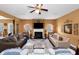 Inviting living room with a fireplace, ceiling fan, and neutral-toned walls at 1104 Stepping Stone Ln, Conyers, GA 30012