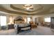 Main bedroom with cozy sitting area, decorative doors, and decorative mirrors at 1104 Stepping Stone Ln, Conyers, GA 30012