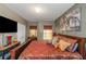 Comfortable primary bedroom featuring stylish lighting and decorative finishes at 1104 Stepping Stone Ln, Conyers, GA 30012